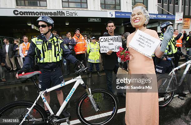 Police hold back a protestor during a "Stop Bush - Make Howard History Rally" held at Sydney Town Hall September 8, 2007 in Sydney, Australia. The...
