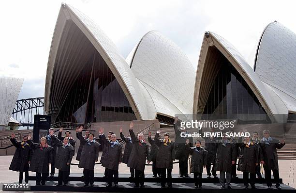 Leaders from the 21 Pacific rim pose for a group photograph at the Sydney Opera House, 08 September 2007, during the Asia-Pacific Economic...