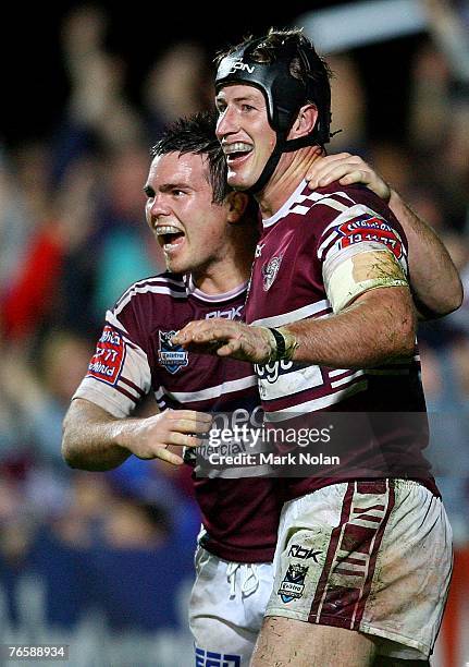 Steve Menzies of the Eagles celebrates his try with Jamie Lyon during the NRL qualifying final match between the Manly Sea Eagles and the South...