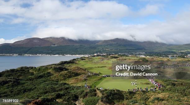 Crowds surrond the third green during the morning foursomes matches in the 2007 Walker Cup Matches on the links of the Royal County Down Golf Club,...