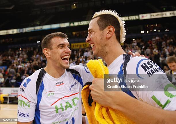 Michal Jurecki of Hamburg celebrates with Pascal Hens after the Bundesliga Handball match between HSV Hamburg and TV Grosswallstadt at the Colorline...