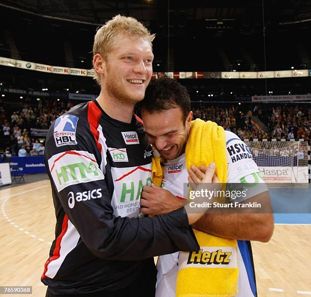 Johannes Bitter celebrates with Bruno Souza of Hamburg after the Bundesliga Handball match between HSV Hamburg and TV Grosswallstadt at the Colorline...