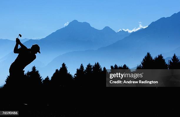 Oliver Wilson of England hits his second shot on the 17th hole during the third round of the Omega European Masters at Crans-Sur-Sierre Golf Club on...