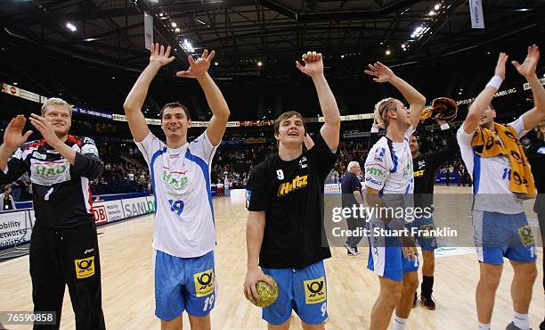 Players of Hamburg celebrate after the Bundesliga Handball match between HSV Hamburg and TV Grosswallstadt at the Colorline Arena on September 8,...