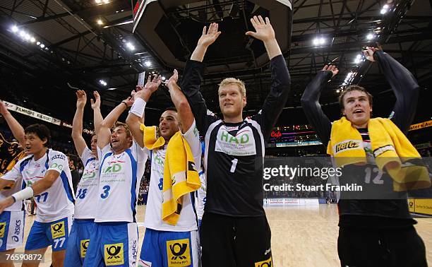 Players of Hamburg celebrate after the Bundesliga Handball match between HSV Hamburg and TV Grosswallstadt at the Colorline Arena on September 8,...