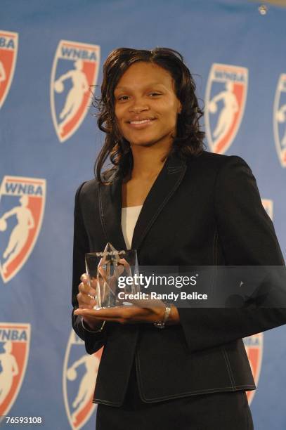 Armintie Price of the Chicago Sky poses with the trophy after a press conference naming her the 2007 WNBA Rookie of the Year at The Palace of Auburn...