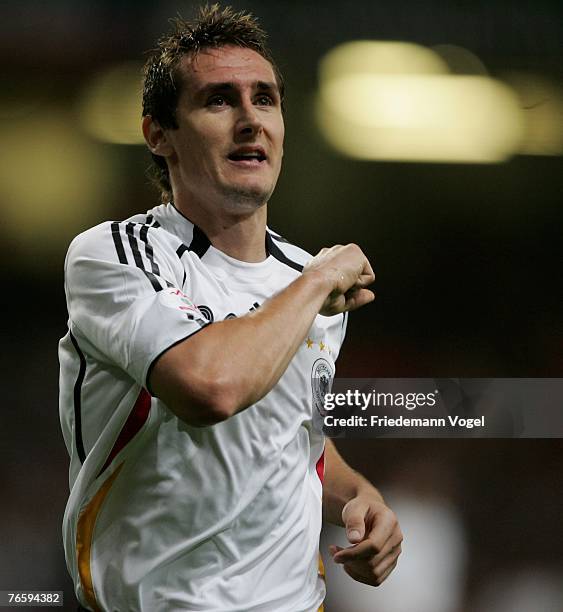 Miroslav Klose of Germany celebrates scoring the second goal during the Euro 2008 qualifying match between Wales and Germany at the Millennium...