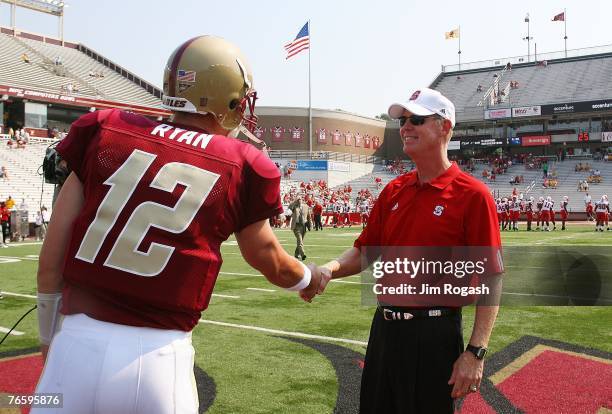 Quarterback Matt Ryan of the Boston College Eagles greets coach Tom O'Brien of the North Carolina Wolfpack before their game at Alumni Stadium...