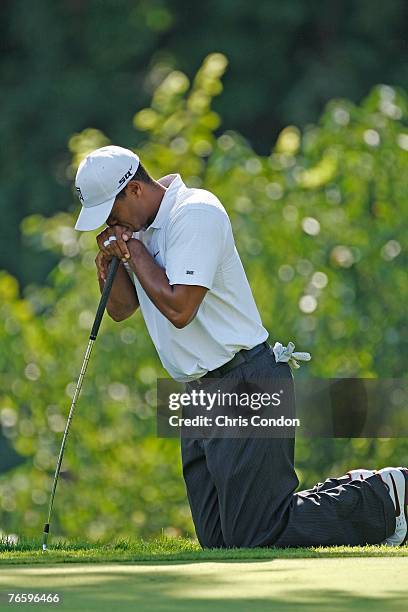Tiger Woods misses a birdie putt on the 16th green during the third round of BMW Championship, the third event of the new PGA TOUR Playoffs for the...