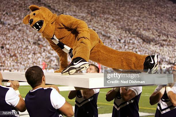 The Nittany Lion mascot of the Penn State Nittany Lions does a pushup for each point during the game against the University of Notre Dame Fighting...