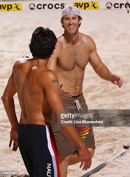 John Hyden and Mike Lambert celebrate during the match against Phil Dalhausser and Sean Rosenthal at the AVP Las Vegas God & Goddess of the Beach at...