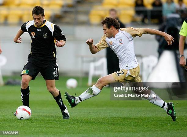 Felipe of the Phoenix gets tackled by Paul Kohler of the Jets during the round three A-League match between the Wellington Phoenix and the Newcastle...