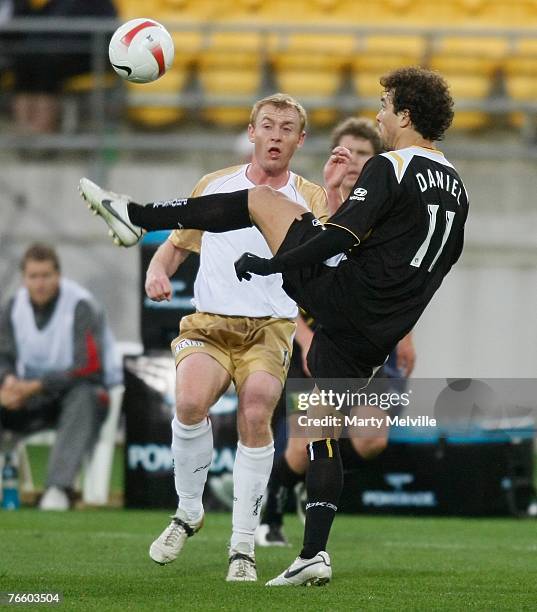 Daniel of the Phoenix takes a high pass with Jobe Wheelhouse of the Jets during the round three A-League match between the Wellington Phoenix and the...