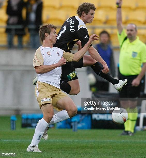 Tony Lochhead of the Phoenix takes a high pass with Steve Eagleton of the Jets during the round three A-League match between the Wellington Phoenix...