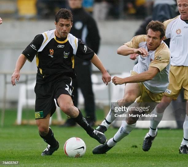 Felipe of the Phoenix is tackled by Paul Kohler of the Jets during the round three A-League match between the Wellington Phoenix and the Newcastle...