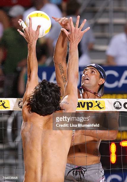 Fred Souza and Phil Dalhausser , returns the ball against Mike Lambert at the AVP Las Vegas God & Goddess of the Beach at Caesars Palace on September...