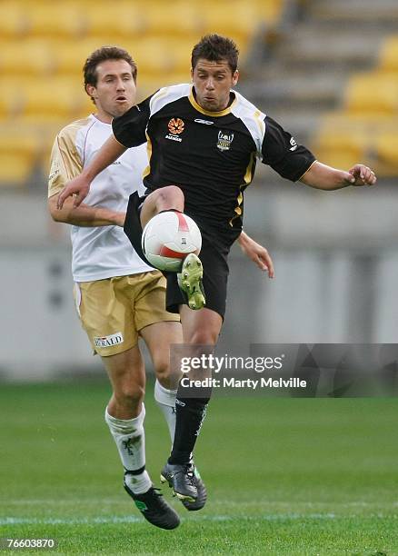 Felipe of the Phoenix takes a high pass with Paul Kohler of the Jets during the round three A-League match between the Wellington Phoenix and the...