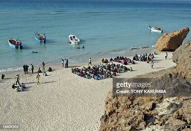 Illegal Somali and Ethiopian migrants wait to embark on boats 07 September 2007 on a voyage to Yemen on Shinbivale beach, 17 kms, east of Bosasso,...