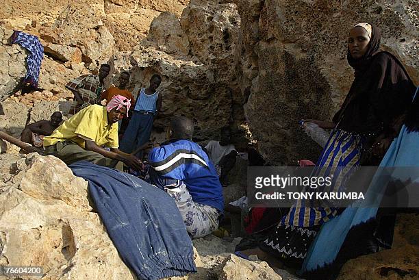 Illegal immigrants wait in caves 07 September 2007 to embark on a voyage to Yemen, ferrying illegal migrants, mainly Ethiopian nationals from...