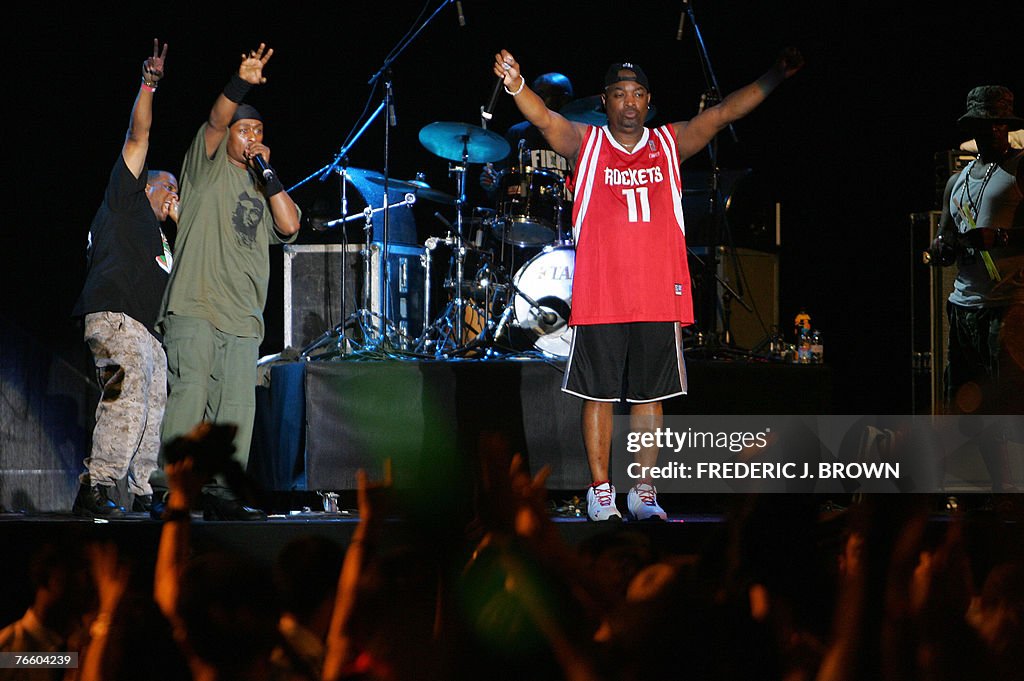 Public Enemy acknowledge the crowd after
