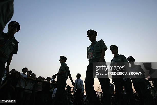 Security personnel marched out as the sun goes down in a display of crowd control, 08 September 2007, as some of the most subversive and hard-hitting...