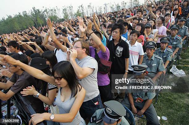 Line of security guards stay seated in an attempt of crowd control as fans rock to the music, 08 September 2007, as some of the most subversive and...