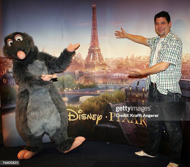 Chef Tim Maelzer and a costume Character pose at the photo call for the new movie Ratatouille at the CCH Congress Center on September 9, 2007 in...