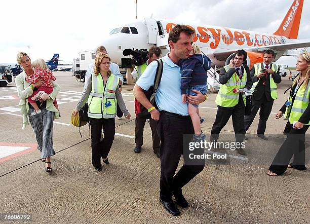 Kate and Gerry McCann the parents of missing four-year-old Madeleine McCann arrive back in the UK to East Midlands airport, after taking a flight...