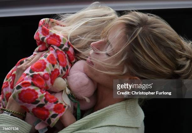 Kate McCann arrives home carrying her daughter Amelie on September 9, 2007 in Rothley, England. The McCann family have returned from Portugal after...
