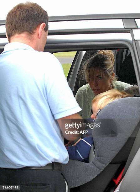 The parents of missing toddler Madeleine McCann, Kate and Gerry with their two-year-old twin children Sean and Amelie take place in a car as they...