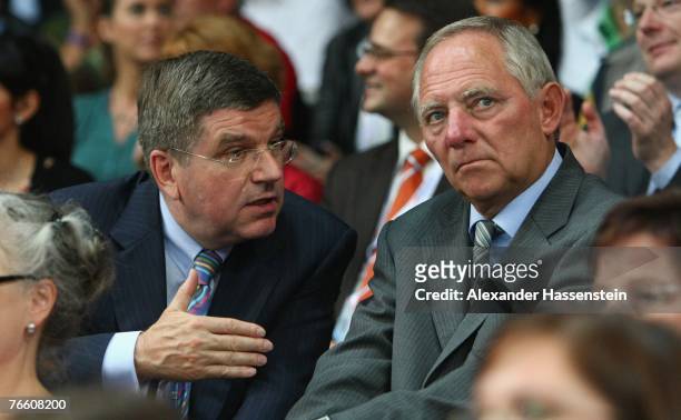 German Olympic Sports Federation head Thomas Bach chats with German Interior Minister Wolfgang Schaeuble chats during the 40th World Artistic...