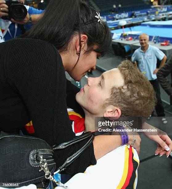 Fabian Hambuechen kisses his girlfriend Viktoria Kaminier after winning the men?s High Bar final competition of the 40th World Artistic Gymnastics...