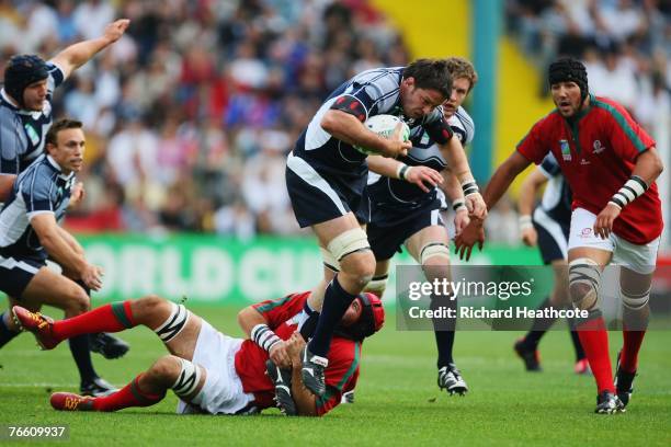 Scott Murray of Scotland is stopped by Vasco Uva of Portugal during match seven of the Rugby World Cup 2007 between Scotland and Portugal at the...