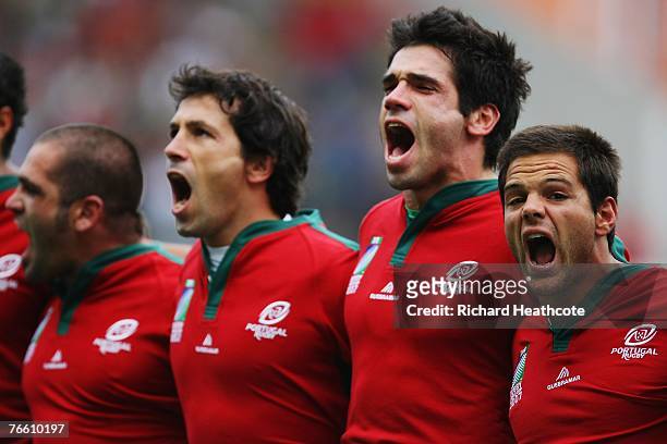 Pedro Leal of Portugal screams his national anthem with team mates Diogo Coutinho and Federico Sousa prior to match seven of the Rugby World Cup 2007...