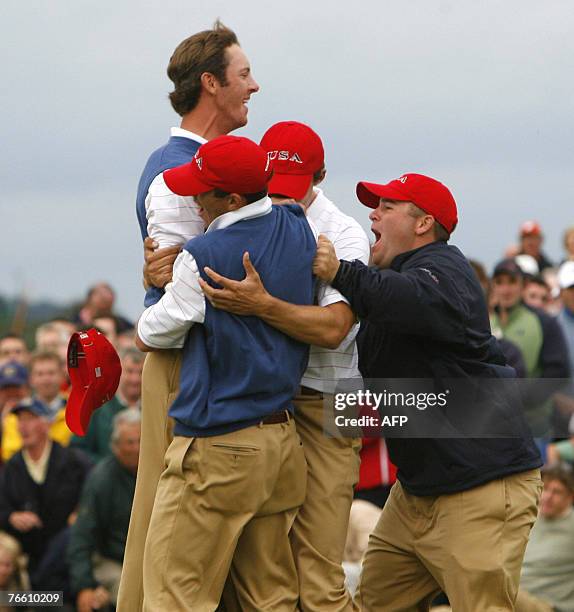 Jonathan Moore of USA celebrates with his teammates after putting for an eagle to retain the Walker Cup for the USA 09 September 2007 during the...