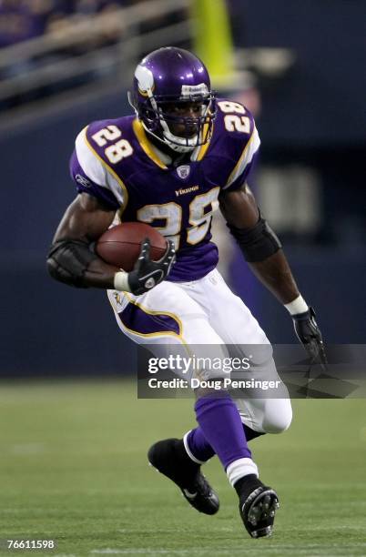 Adrian Peterson of the Minnesota Vikings rushes against the Atlanta Falcons during week one NFL action at the Metrodome on September 9, 2007 in...