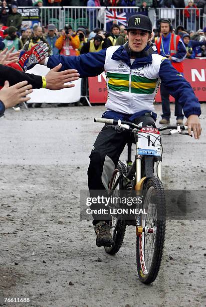 Samuel Hill of Australia celebrates taking the gold medal in the Men's Elite Downhill finals at the 2007 UCI Mountain Bike & Trials World...