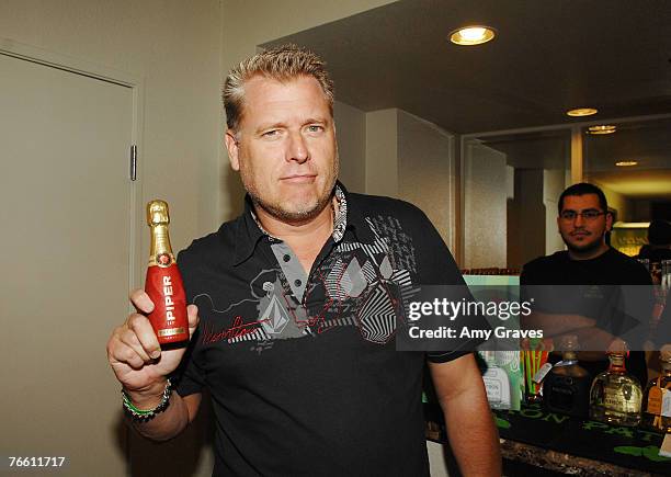 Joe Simpson holds a bottle of Piper Heidsieck champagne at the Star Lounge In Honor of Rolling Stone's 40th Anniversary at the Hard Rock Hotel and...