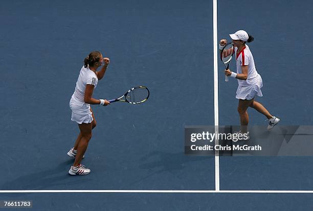 Nathalie Dechy of France and Dinara Safina of Russia celebrate match point of their 6-4, 6-2 win against Yung-Jan Chan and Chia-Jung Chuang of...