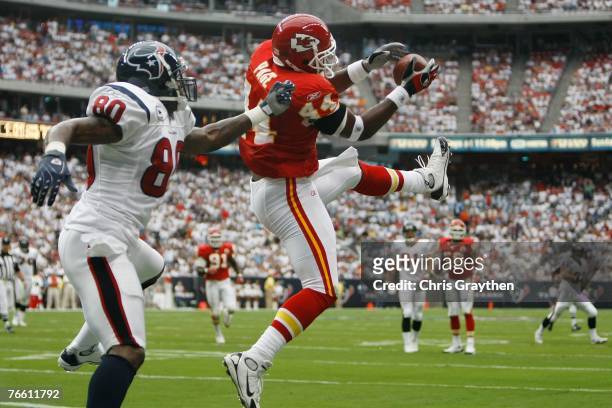 Jarrad Page of the Kansas City Chiefs intercepts a ball in the endzone intended for Andre Johnson of the Houston Texans at Reliant Stadium September...