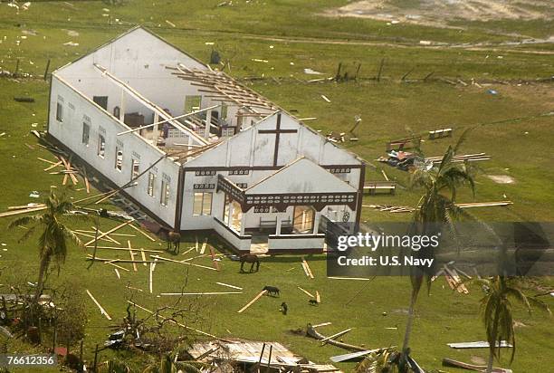 In this handout provided by the U.S. Navy, an aerial view from a U.S. Navy helicopter shows a church severely damaged by Hurricane Felix September 7,...