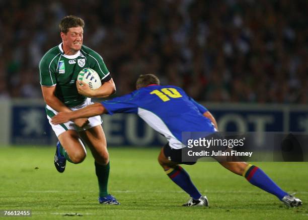 Ronan O'Gara of Ireland is tackled by Emile Wessels of Namibia during Match Eight of the Rugby World Cup 2007 between Ireland and Namibia at the...