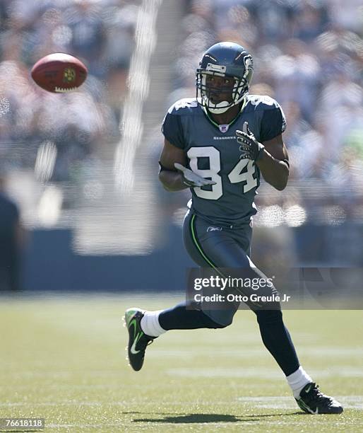 Wide receiver Bobby Engram of the Seattle Seahawks makes a catch against the Tampa Bay Buccaneers at Qwest Field on September 9, 2007 in Seattle,...