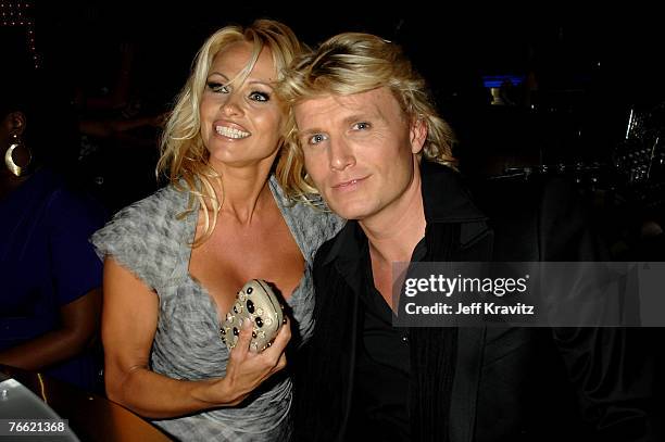 Actress Pamela Anderson and guest attend the 2007 MTV Video Music Awards at the Palms Casino Resort on September 9, 2007 in LasVegas, Nevada.