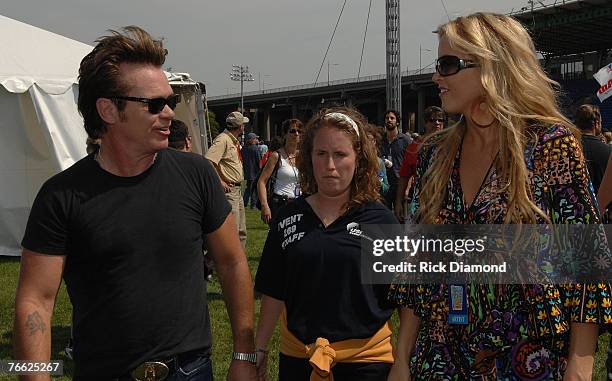 Artist John Mellencamp and Artist Pauline Reese Backstage at Farm Aid 2007 at ICAHN Stadium on Randall's Island, NY September 9,2007.