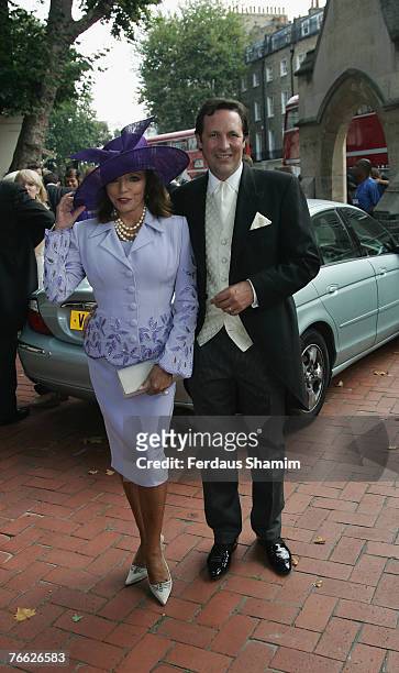 Joan Collins and Guest attends the wedding of Chloe Delevingne and Louis Buckworth on September 7, 2007 in London, England.