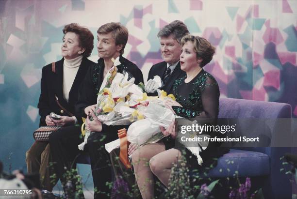 English ice dancers Jayne Torvill and Christopher Dean of the Great Britain team pictured together with coaching staff Betty Callaway and Bobby...