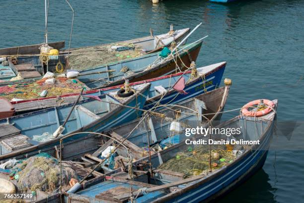 port city of villanjam (vizhinjam) along coast of arabian sea, traditional wooden fishing boats in harbor, malabar coast, kerala, india - malabar coast stock pictures, royalty-free photos & images