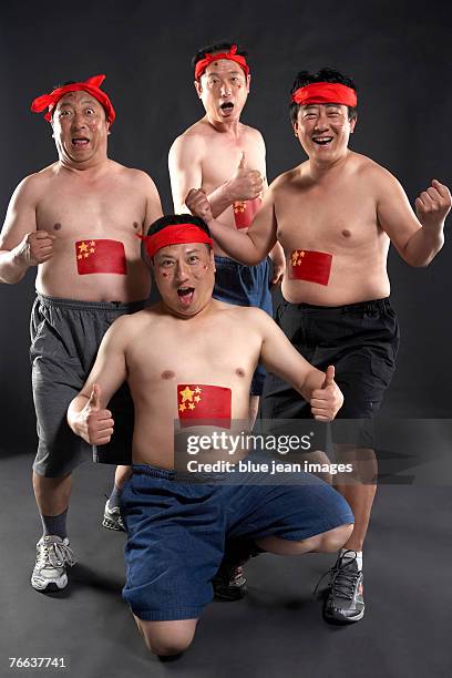 four soccer fans are complacent. - china fans cheer stock pictures, royalty-free photos & images