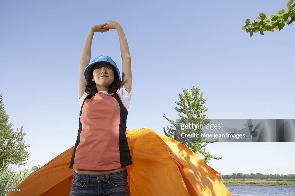 A young woman is doing exercises.